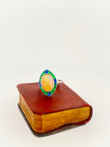 18k WG Opal cabochon ring with emerald and sapphire (5.18 ct) halo and diamonds